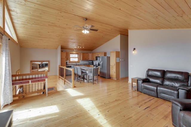 living room featuring lofted ceiling, light wood finished floors, ceiling fan, and wooden ceiling