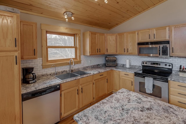 kitchen featuring a sink, stainless steel appliances, vaulted ceiling, light brown cabinetry, and wood ceiling