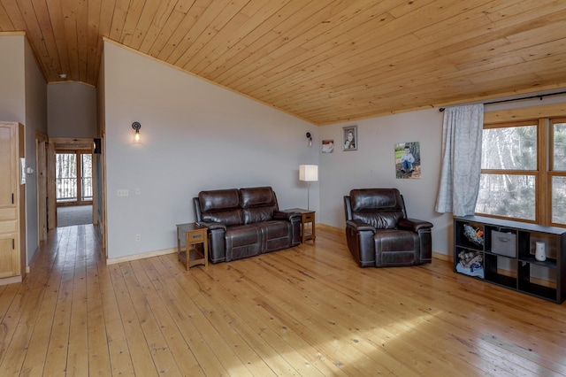 living area featuring vaulted ceiling, light wood finished floors, wood ceiling, and baseboards
