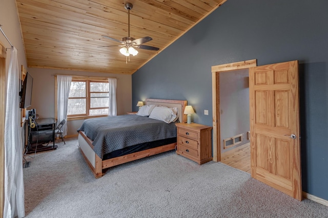 bedroom with visible vents, vaulted ceiling, ceiling fan, carpet floors, and wood ceiling