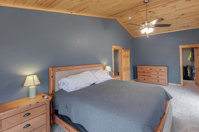 bedroom featuring a closet, carpet, wooden ceiling, vaulted ceiling, and ceiling fan
