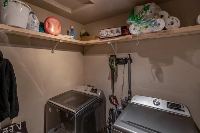 laundry area with washing machine and dryer and laundry area