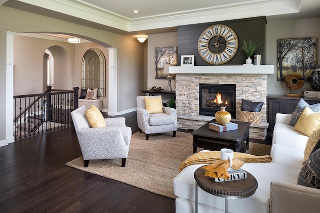 14897 144th Ave N, Dayton, MN 55327 - living area featuring wood finished floors, crown molding, a tray ceiling, arched walkways, and a stone fireplace