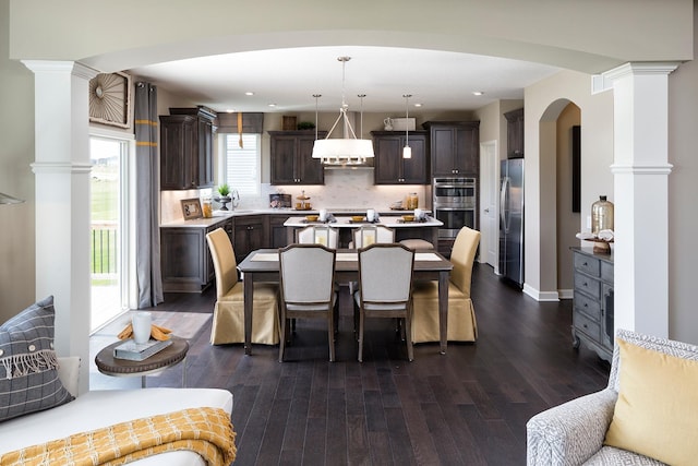 14897 144th Ave N, Dayton, MN 55327 - dining space with dark wood-type flooring, ornate columns, and recessed lighting
