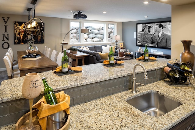 14897 144th Ave N, Dayton, MN 55327 - kitchen with a sink, light stone countertops, recessed lighting, open floor plan, and hanging light fixtures