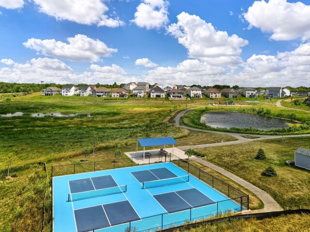 14897 144th Ave N, Dayton, MN 55327 - view of property's community with a tennis court, a residential view, fence, and a water view