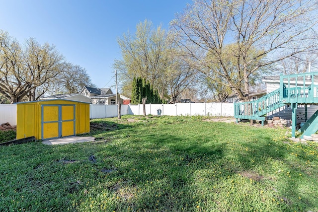 view of yard with a storage unit and an outbuilding
