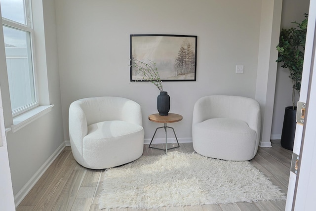 5275 94th Ln N, Brooklyn Park, MN 55443 - sitting room with baseboards and wood finished floors