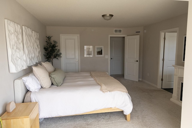 5275 94th Ln N, Brooklyn Park, MN 55443 - carpeted bedroom featuring baseboards, a fireplace, and visible vents