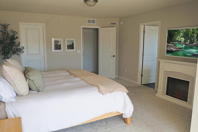 5275 94th Ln N, Brooklyn Park, MN 55443 - bedroom with carpet, visible vents, a fireplace, and baseboards