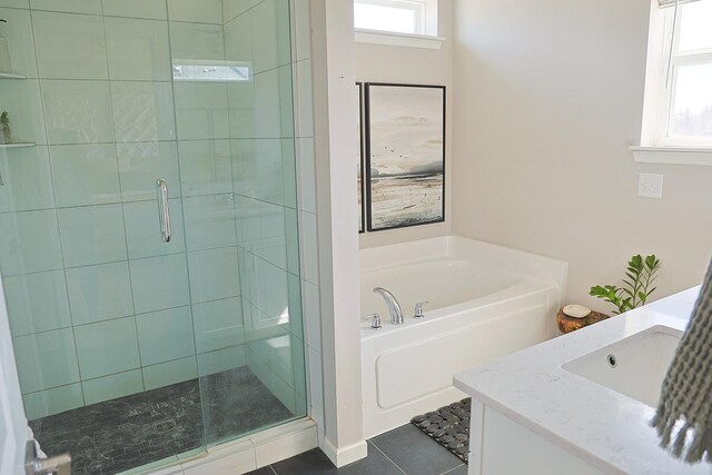 5275 94th Ln N, Brooklyn Park, MN 55443 - full bath with a shower stall, tile patterned floors, a healthy amount of sunlight, and a garden tub