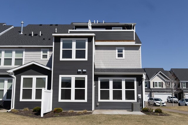 5275 94th Ln N, Brooklyn Park, MN 55443 - back of house with a balcony and cooling unit
