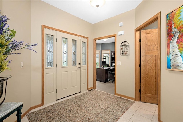 2222 White Oak Ct, Hudson, WI 54016 - foyer with light tile patterned floors and baseboards