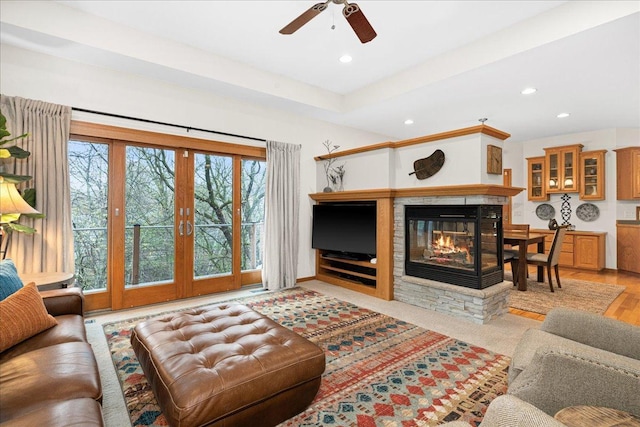 2222 White Oak Ct, Hudson, WI 54016 - living area featuring a multi sided fireplace, recessed lighting, ceiling fan, and light wood-style floors