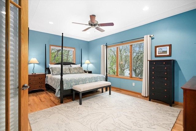 2222 White Oak Ct, Hudson, WI 54016 - bedroom featuring wood finished floors, multiple windows, crown molding, recessed lighting, and ceiling fan