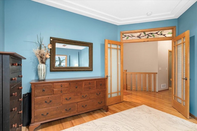 2222 White Oak Ct, Hudson, WI 54016 - bedroom with wood finished floors and french doors