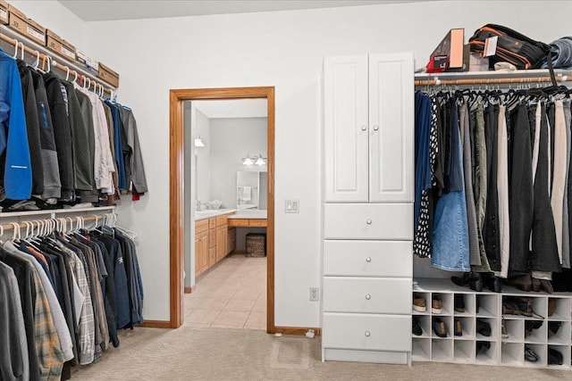 2222 White Oak Ct, Hudson, WI 54016 - walk in closet with light colored carpet and light tile patterned floors