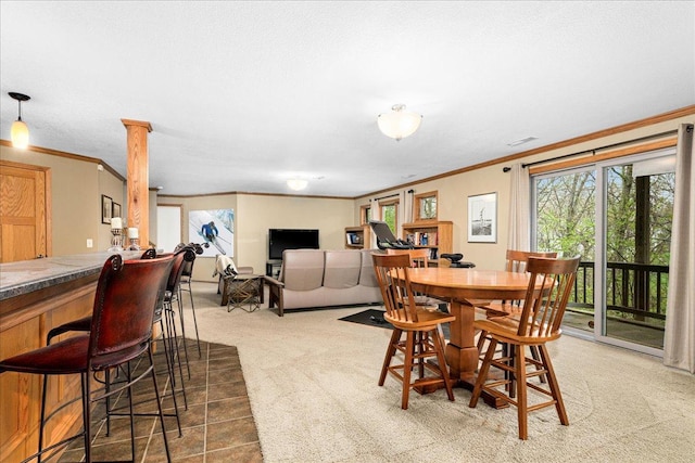 2222 White Oak Ct, Hudson, WI 54016 - dining room with ornamental molding, light colored carpet, and a dry bar