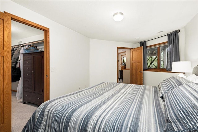 2222 White Oak Ct, Hudson, WI 54016 - bedroom featuring carpet, a walk in closet, and a closet