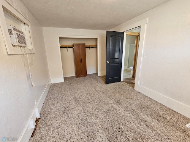 unfurnished bedroom featuring carpet flooring, a closet, and baseboards