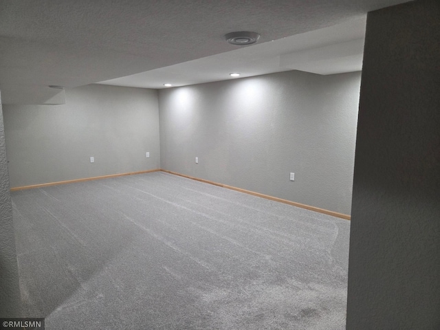 finished basement featuring baseboards, recessed lighting, and carpet floors