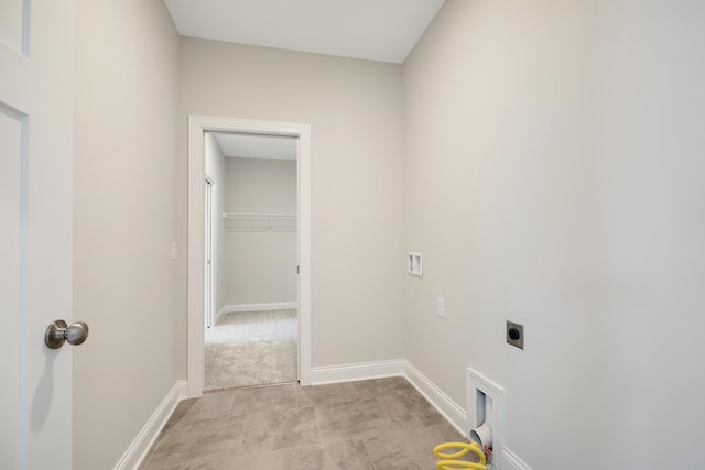 washroom with baseboards, laundry area, and electric dryer hookup