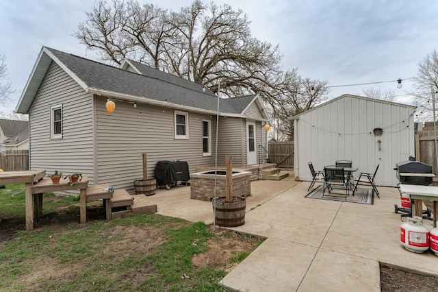 15 2nd St SE, Dodge Center, MN 55927 - rear view of property with outdoor dining area, fence, a shingled roof, and a patio