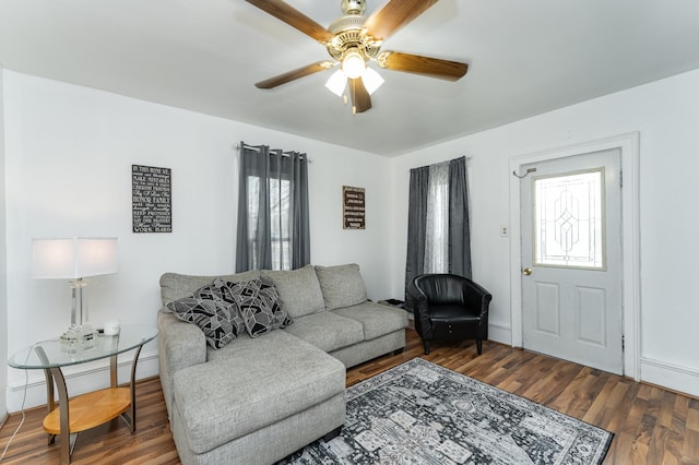 15 2nd St SE, Dodge Center, MN 55927 - living room featuring wood finished floors, baseboard heating, and ceiling fan