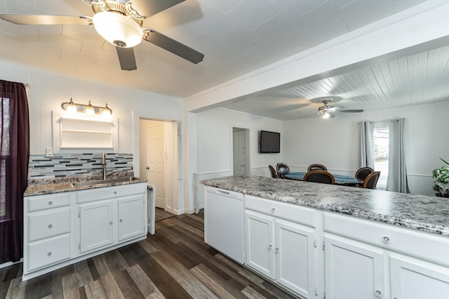 15 2nd St SE, Dodge Center, MN 55927 - kitchen featuring a sink, tasteful backsplash, ceiling fan, dark wood-style floors, and white dishwasher