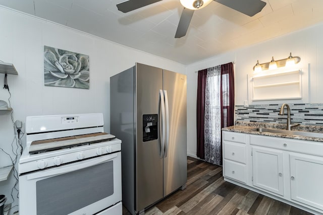 15 2nd St SE, Dodge Center, MN 55927 - kitchen with stainless steel fridge, a ceiling fan, a sink, white gas range, and dark wood-style flooring
