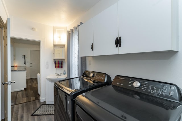 15 2nd St SE, Dodge Center, MN 55927 - laundry room with washing machine and dryer and dark wood finished floors