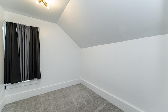 15 2nd St SE, Dodge Center, MN 55927 - additional living space featuring lofted ceiling, carpet flooring, and baseboards