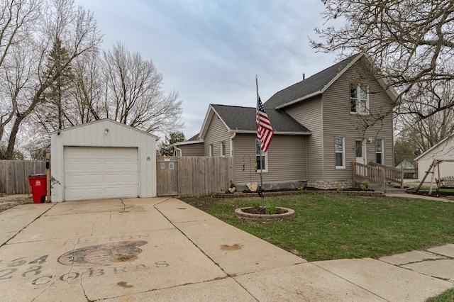15 2nd St SE, Dodge Center, MN 55927 - view of side of property with a yard, fence, a shingled roof, and concrete driveway