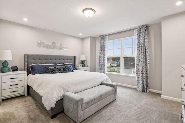 bedroom with carpet, baseboards, recessed lighting, and a textured ceiling