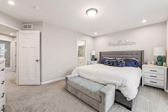 carpeted bedroom featuring recessed lighting, baseboards, and connected bathroom