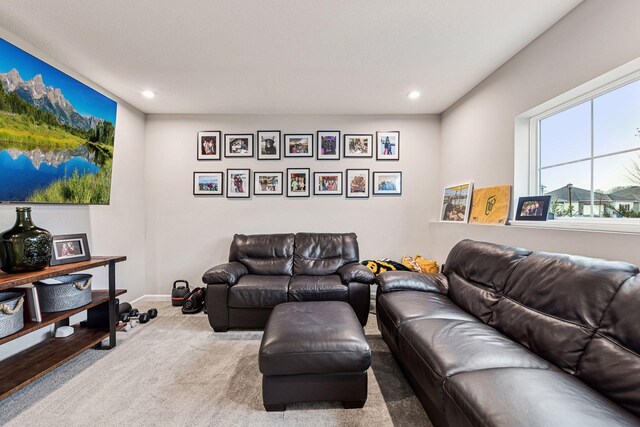carpeted living room with recessed lighting