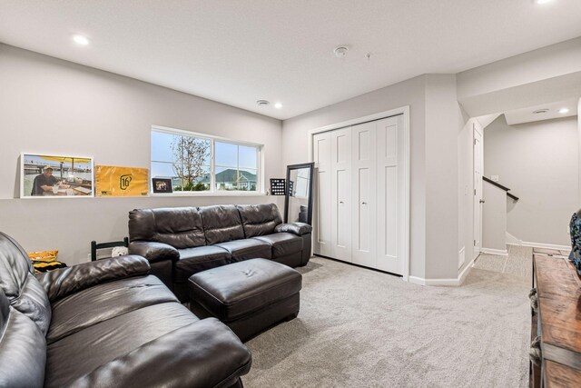 carpeted living room with baseboards and recessed lighting