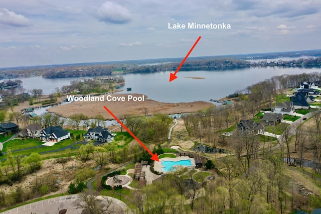 aerial overview of property's location with a large body of water and a pool
