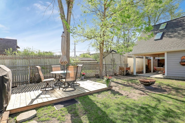 2102 Pinehurst Ave, Saint Paul, MN 55116 - view of yard featuring an outdoor fire pit, a deck, and outdoor dining space