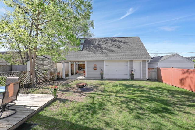 2102 Pinehurst Ave, Saint Paul, MN 55116 - view of yard with a deck, a garage, and an outdoor structure