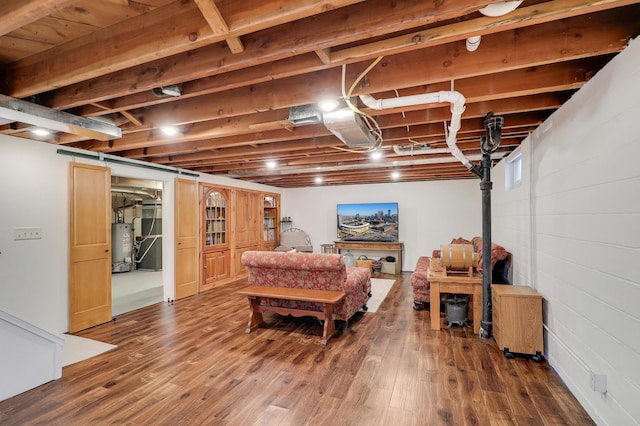 2102 Pinehurst Ave, Saint Paul, MN 55116 - living area with gas water heater and wood finished floors