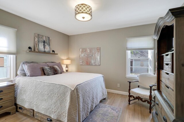 2102 Pinehurst Ave, Saint Paul, MN 55116 - bedroom featuring light wood-style flooring and baseboards