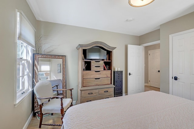2102 Pinehurst Ave, Saint Paul, MN 55116 - bedroom with baseboards and wood finished floors