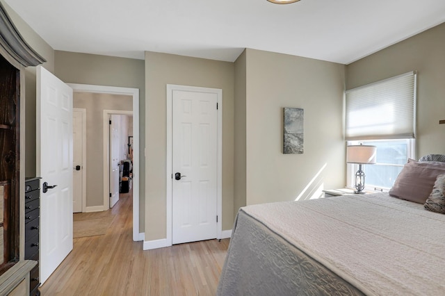 2102 Pinehurst Ave, Saint Paul, MN 55116 - bedroom with light wood-style flooring and baseboards