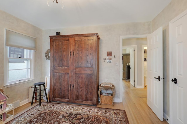 2102 Pinehurst Ave, Saint Paul, MN 55116 - hallway with light wood-style flooring and baseboards