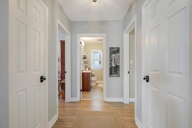 2102 Pinehurst Ave, Saint Paul, MN 55116 - corridor featuring light wood-type flooring and baseboards