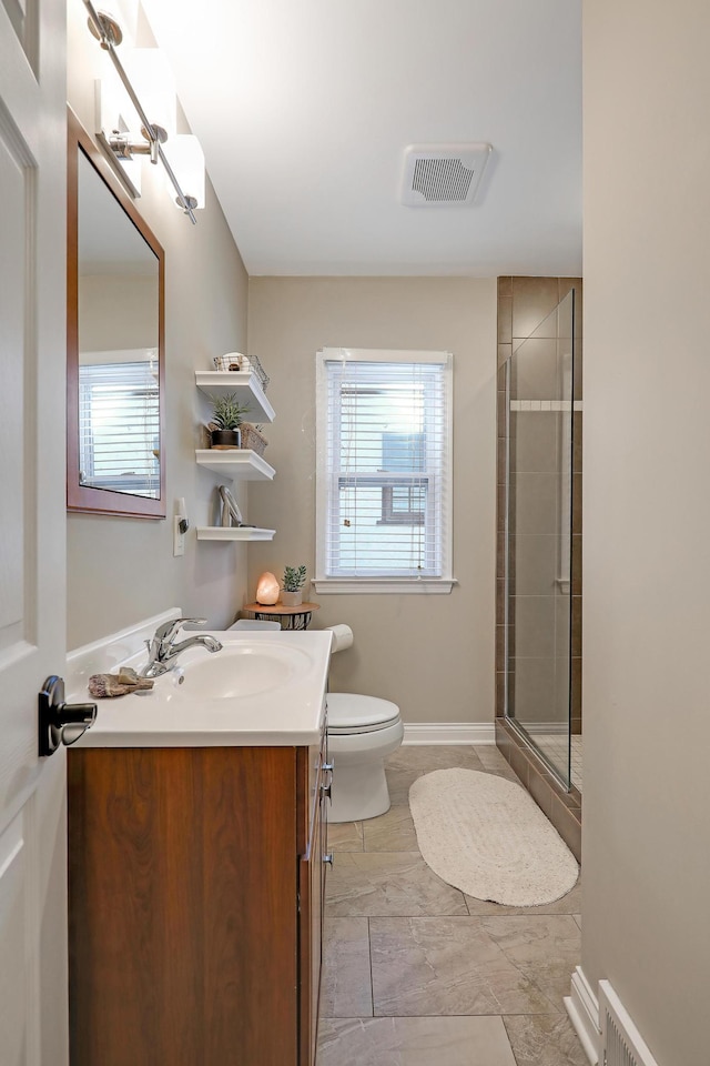 2102 Pinehurst Ave, Saint Paul, MN 55116 - bathroom with tiled shower, healthy amount of natural light, vanity, and toilet