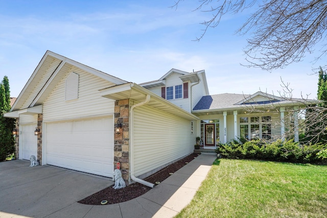 2374 Thrush St, Shakopee, MN 55379 - view of front of home featuring an attached garage, driveway, stone siding, roof with shingles, and a front yard
