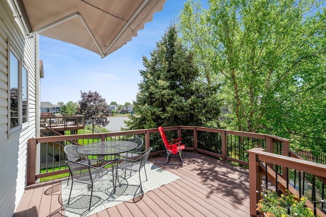 2374 Thrush St, Shakopee, MN 55379 - wooden terrace featuring outdoor dining space and a water view