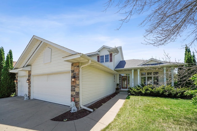 2374 Thrush St, Shakopee, MN 55379 - traditional home with a garage, stone siding, concrete driveway, a front yard, and roof with shingles